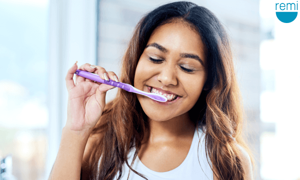 Why does my jaw keep locking?  Woman improving her oral health | ShopRemi.com