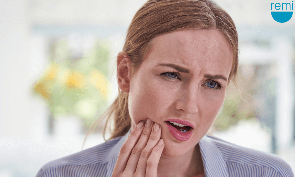 Unconsciously Clenching Jaw Causes, Effects, and Prevention | Remi | Woman with Jaw Pain
