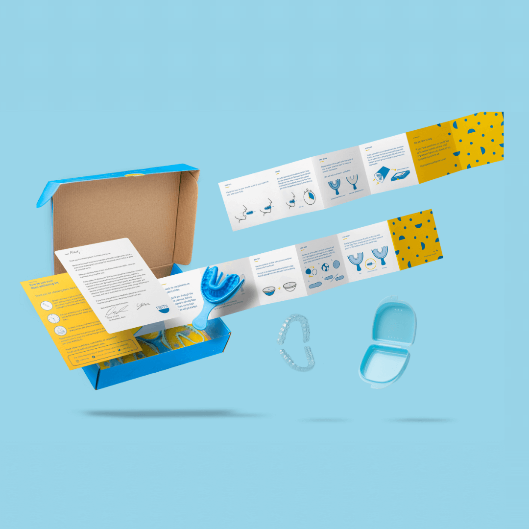 Graphic representation of an orthodontic aligner kit with components and instruction manual floating against a blue background.