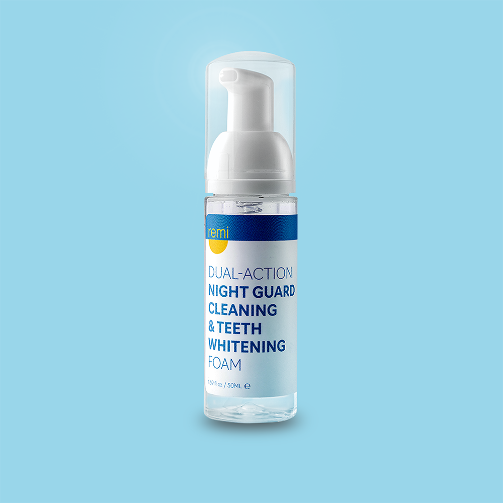 A bottle of Complete Care Retainer Bundle cleaning and whitening foam, 150 mL, sits against a light blue background, ideal for use with retainers or Invisalign.