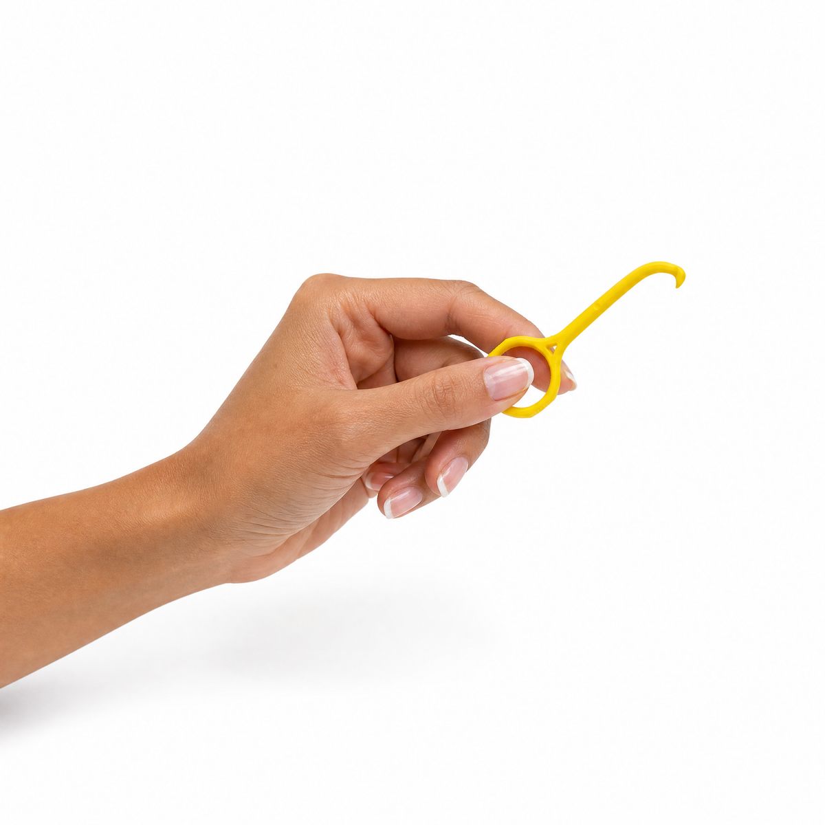Hand holding the Remi removal tool