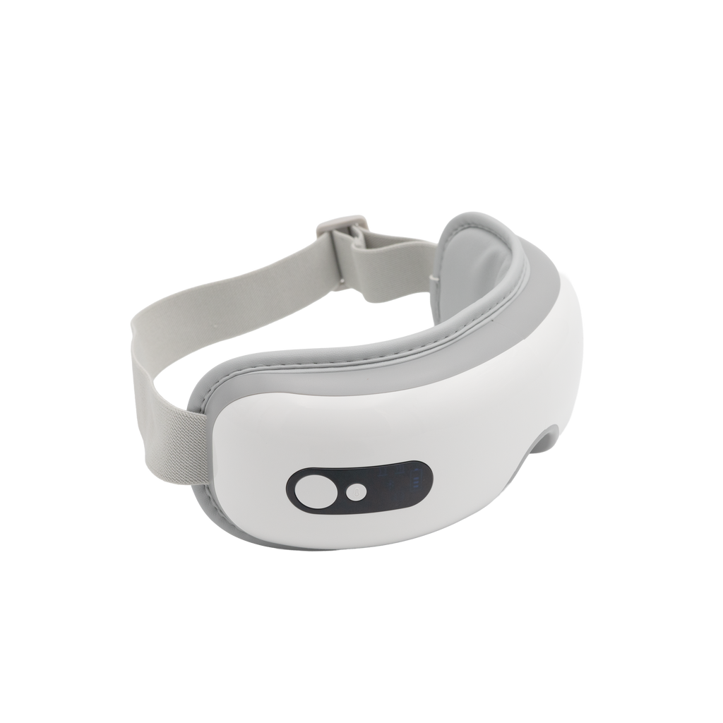 A white and gray electronic eye massager with an adjustable strap and a black control panel featuring two buttons, set against a plain white background—perfect for relaxing after using your ultrasonic cleaner or custom night guard.