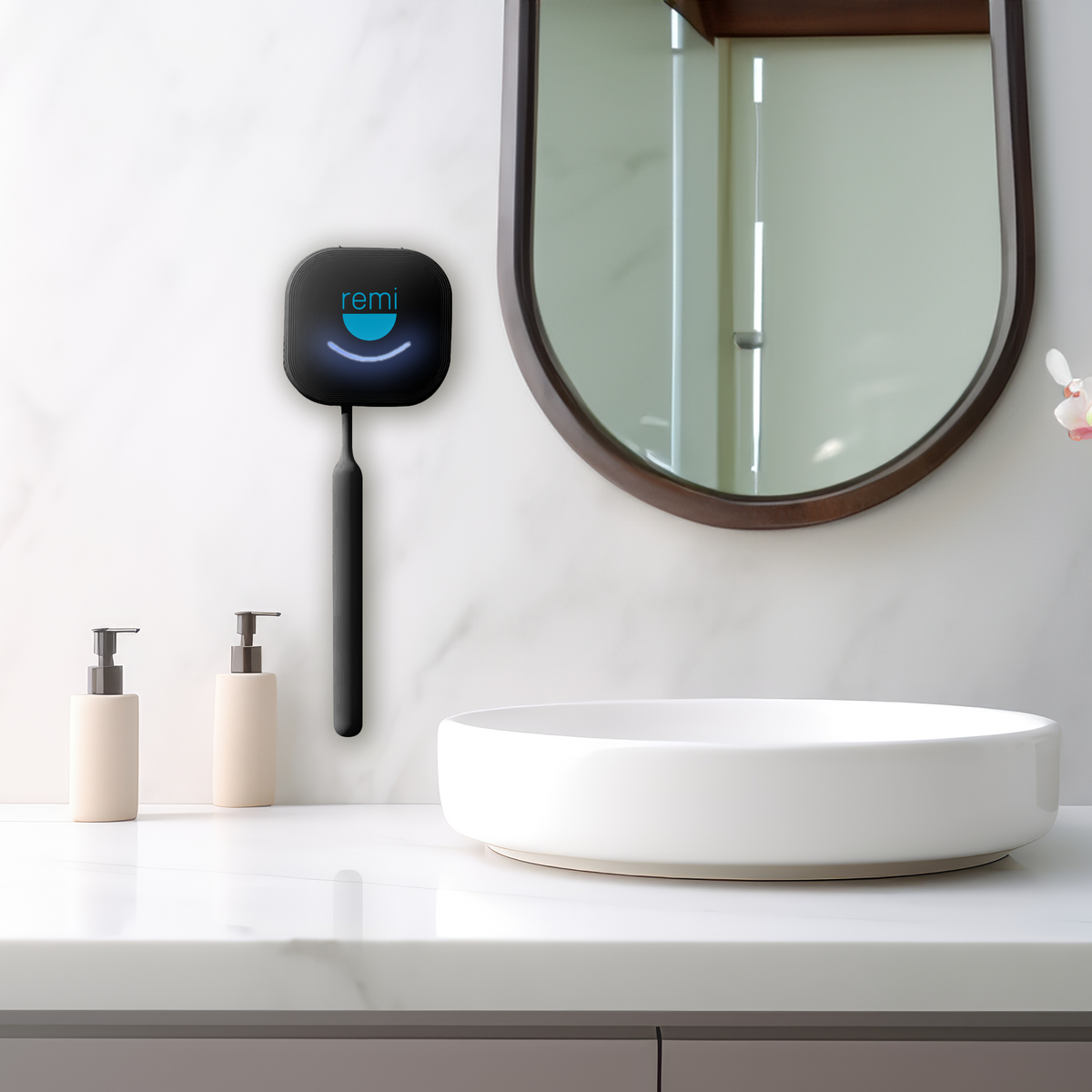 A modern bathroom featuring a white countertop with a rectangular sink, two beige soap dispensers, and a smart mirror displaying the word &quot;remi&quot; alongside a Sterilizer Pro UV Toothbrush Sanitizer designed to sterilize.