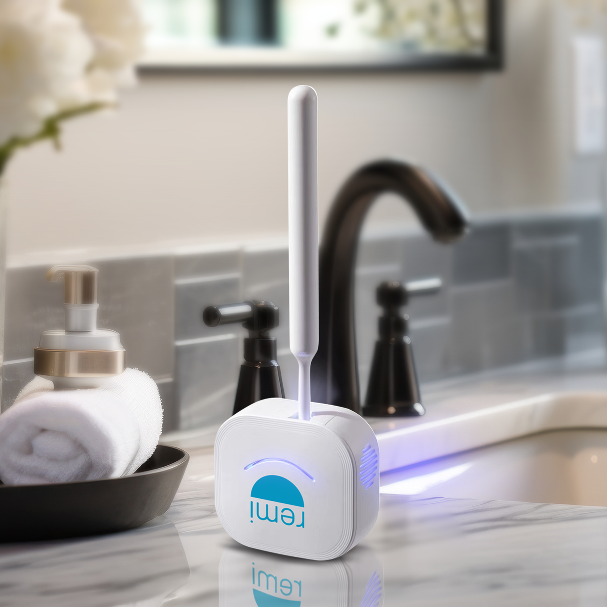 A modern Violight UV Toothbrush Sanitizer featuring a sleek design sits on a bathroom countertop illuminated by soft blue light, effectively killing bacteria.