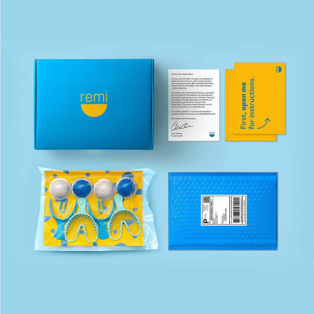 A blue and yellow toothbrush package with an extra tray Replacement Impression Kit for impressions.